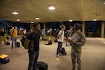 U.S. Air Force basic training trainees that will be placed in a 14-day restriction of movement period arrive at the 737th Training Support Squadron March 24, 2020, at Joint Base San Antonio-Lackland, Texas.