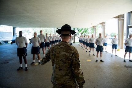 U.S. Air Force basic training trainees that will be placed in a 14-day restriction of movement period arrive at the 737th Training Support Squadron March 24, 2020, at Joint Base San Antonio-Lackland, Texas.