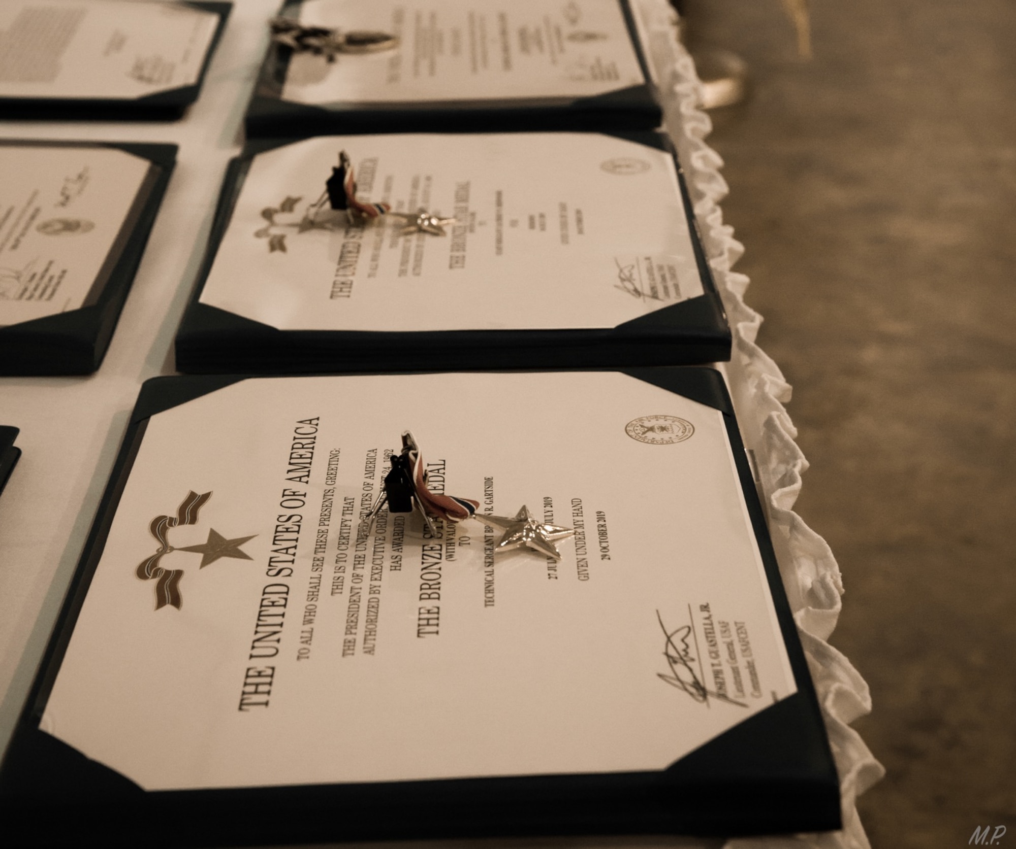Awards lay on a table at the Museum of the Mighty Eighth Air Force in Savannah, Georgia, for a valorous awards ceremony honoring the achievements of Special Tactics Airmen from the 17th Special Tactics Squadron’s Detachment 1 Feb. 18, 2020.