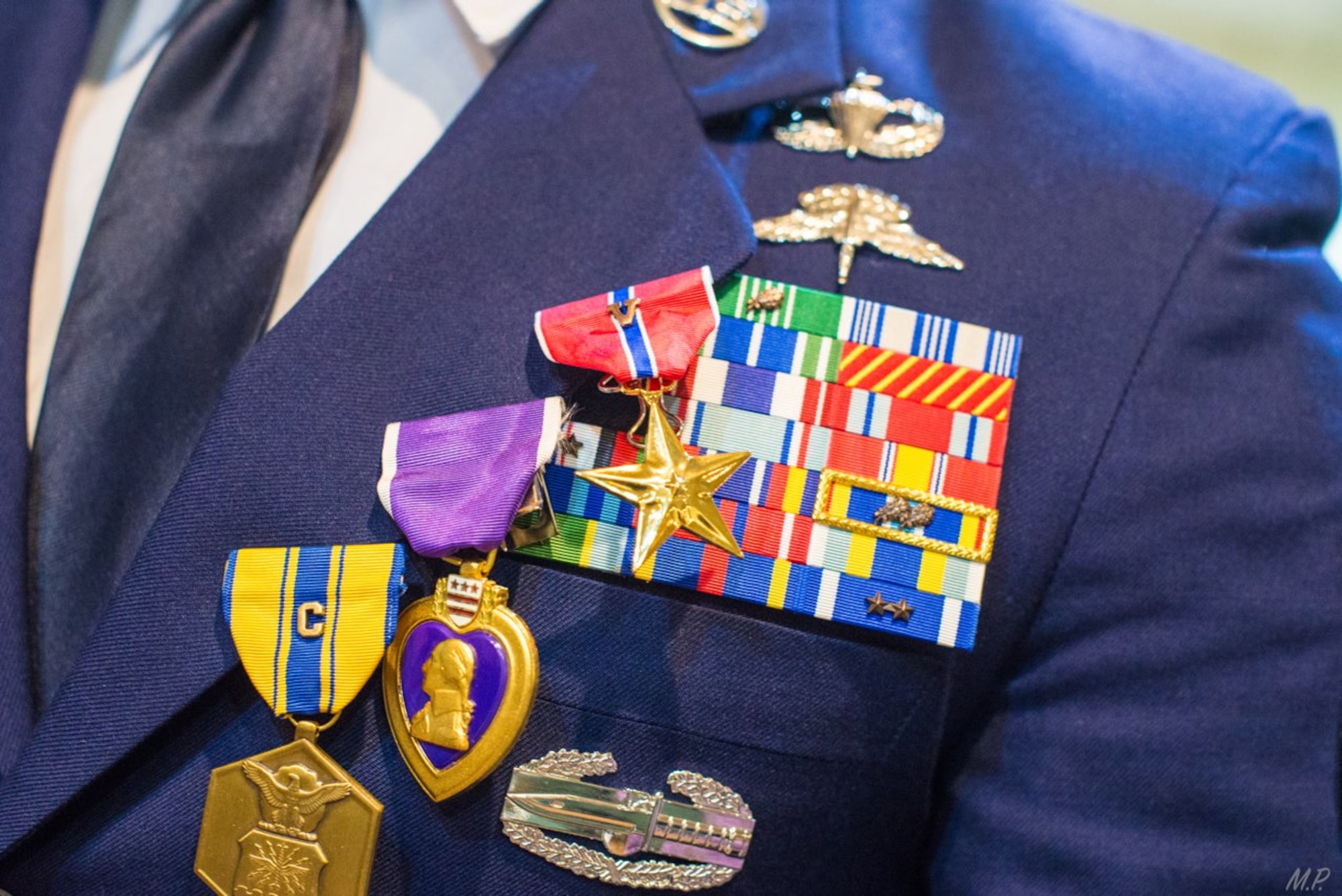 Decorations hang on the blue uniform lapel of an Airman