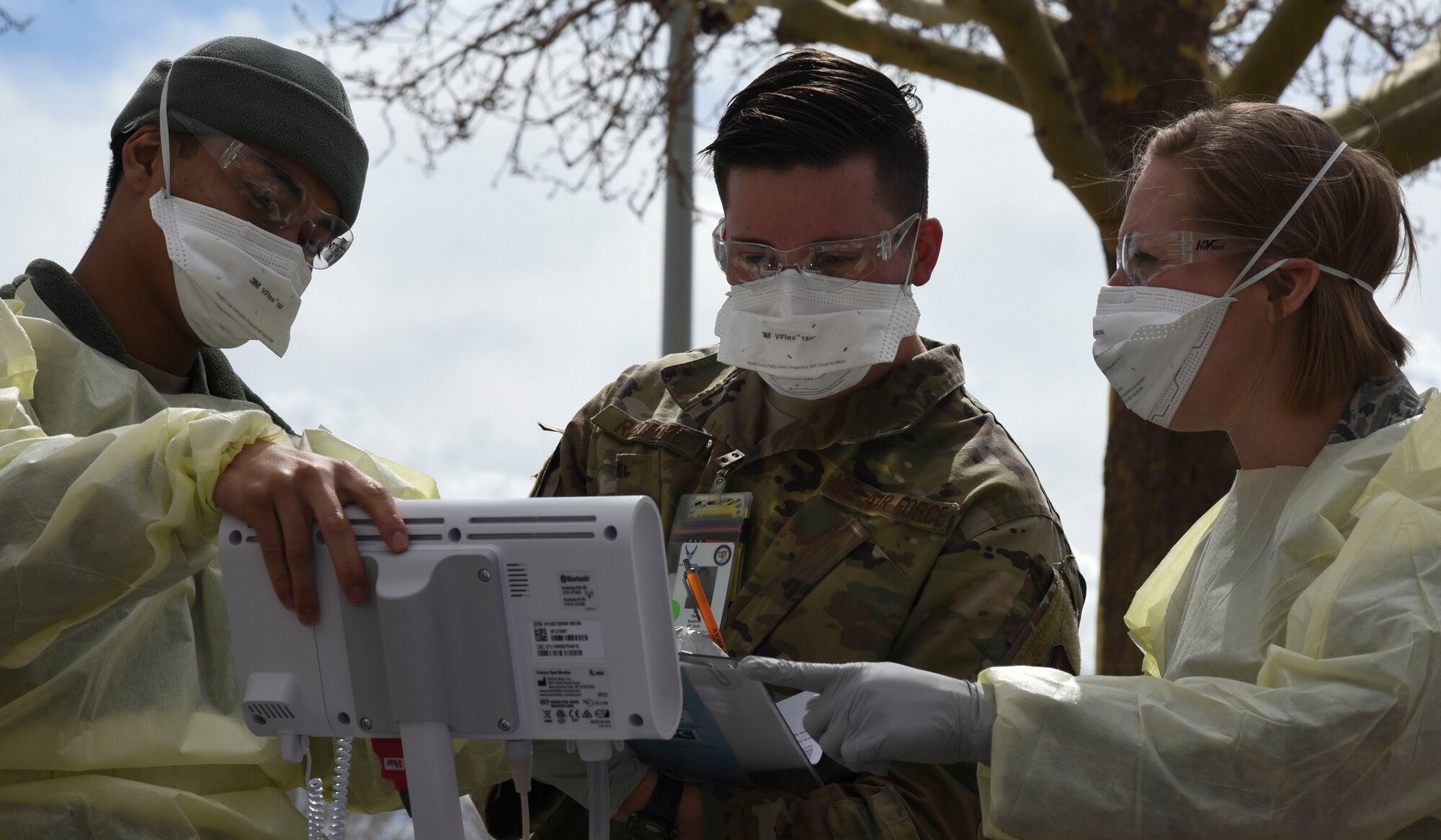 Members of the 377th Medical Group prepare to test a patient for COVID-19