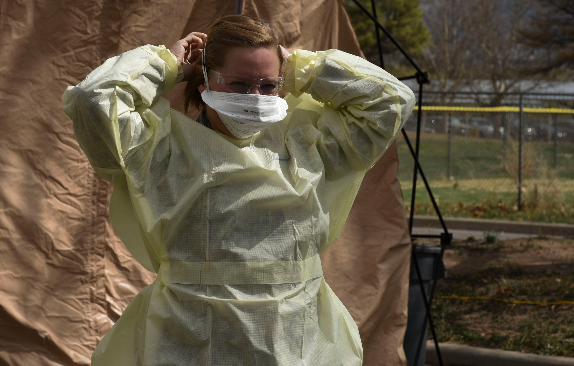 medical personnel put on personal protective equipment (PPE)