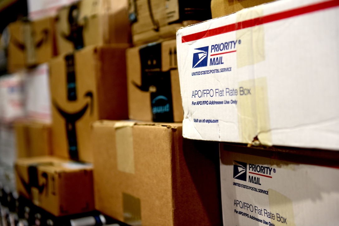 Boxes of mail await sorting at the Aviano Post Office, Aviano Air Base, Italy, March 25, 2020. Hundreds of packages travel through the post office every day, delivering essential items to members of Team Aviano. (U.S. Air Force photo by Staff Sgt. Kelsey Tucker)