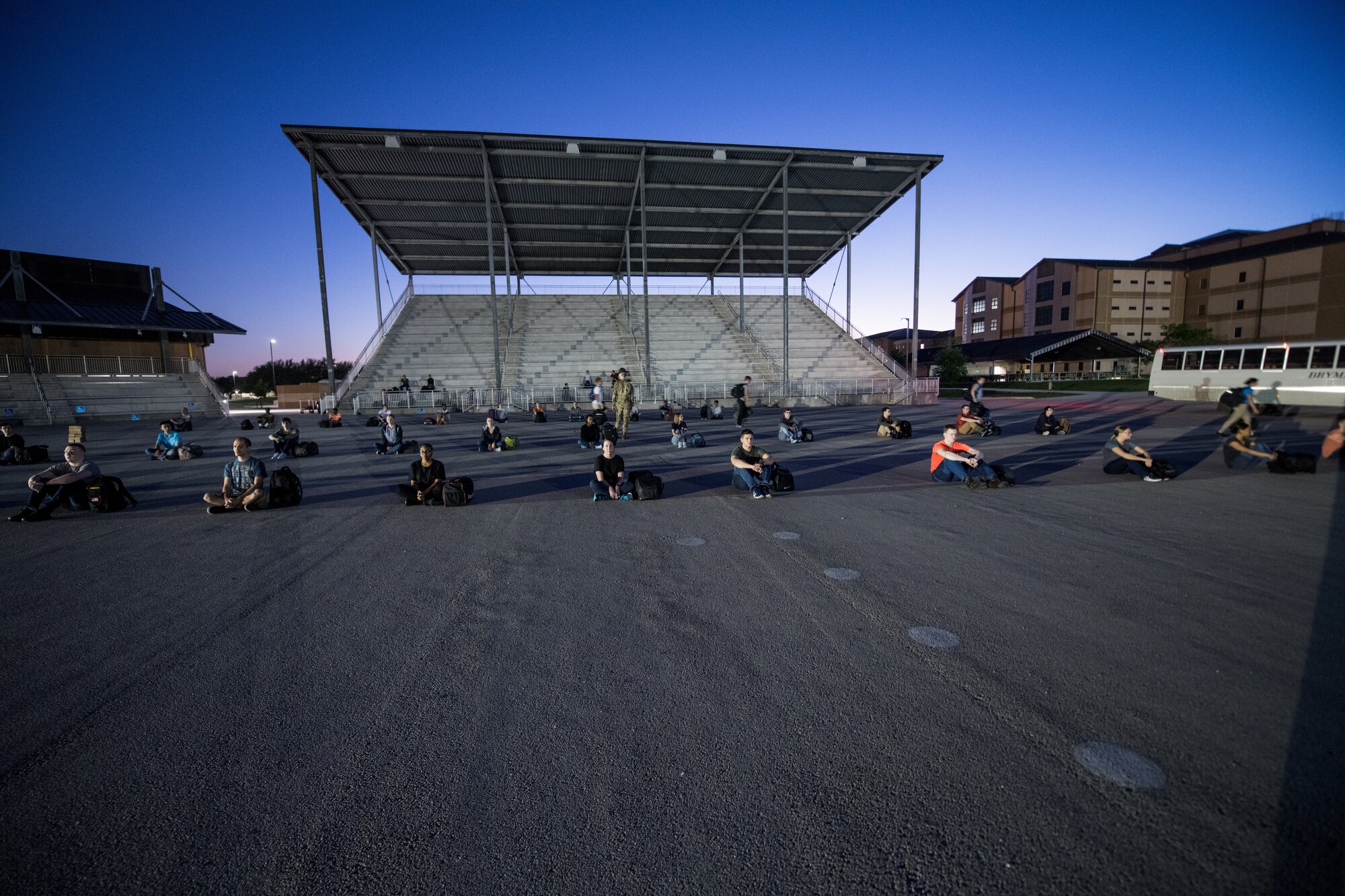 U.S. Air Force basic training trainees that will be placed in a 14-day restriction of movement period arrive at the 737th Training Support Squadron March 24, 2020, at Joint Base San Antonio-Lackland, Texas.