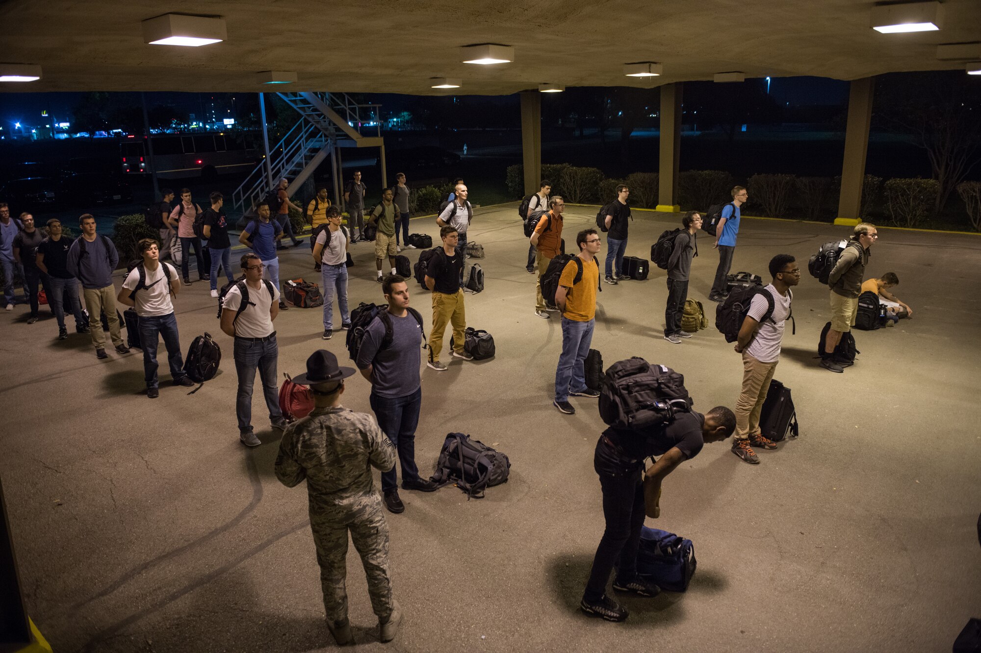 U.S. Air Force basic training trainees that will be placed in a 14-day restriction of movement period arrive at the 737th Training Support Squadron March 24, 2020, at Joint Base San Antonio-Lackland, Texas.