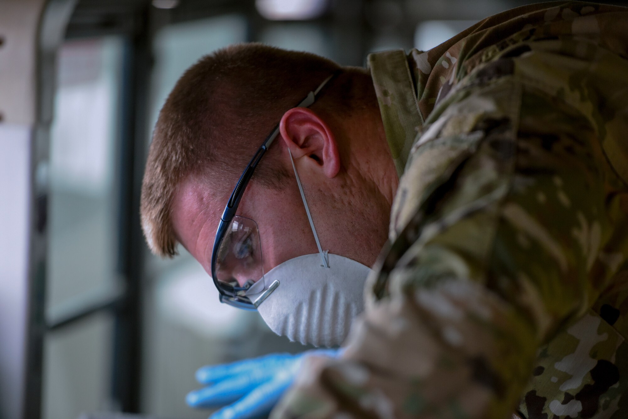 U.S. Air Force Staff Sgt. Colton Webber, 735th Air Mobility Squadron passenger terminal shift supervisor,   decontaminates a bus after transporting passengers to and from the aircraft at Joint Base Pearl Harbor-Hickam, Hawaii, March 25, 2020.

U.S. Indo-Pacific Command (INDOPACOM) directed implementation of Health Protection Condition (HPCON) Charlie March 24, 2020. 

(U.S. Air Force photo by Tech. Sgt. Anthony Nelson Jr. )