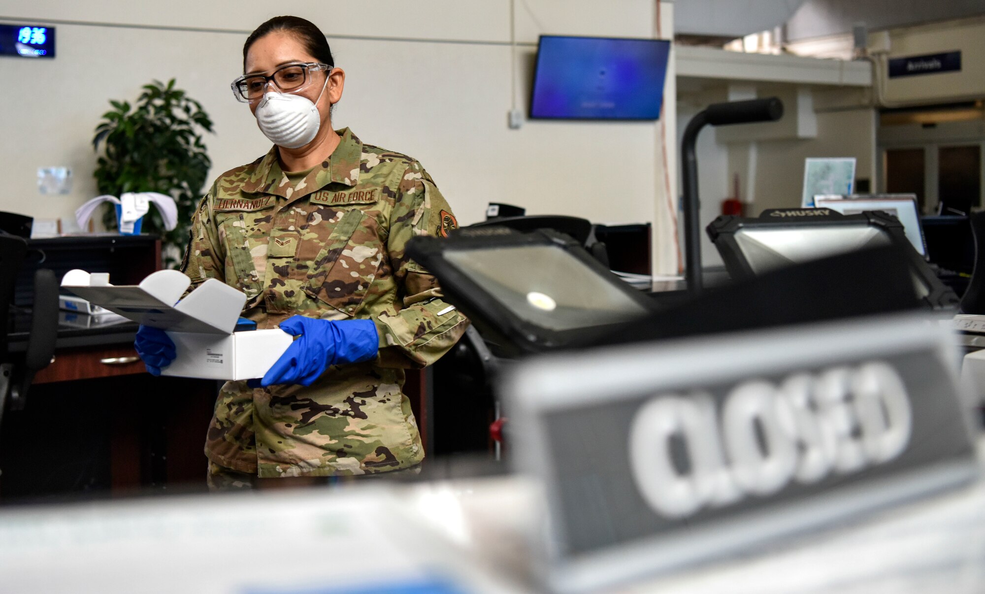 U.S. Air Force Airman 1st Class Griselda Hernandez, 735th Air Mobility Squadron passenger service agent,sanitizes the no-touch thermometers at the Air Mobility Command Passenger Terminal at Joint Base Pearl Harbor-Hickam, Hawaii, March 25, 2020.

Passenger terminal Airmen are screening passengers for fevers to help mitigate the spread of COVID-19.

 (U.S. Air Force photo by Tech. Sgt. Anthony Nelson Jr.)