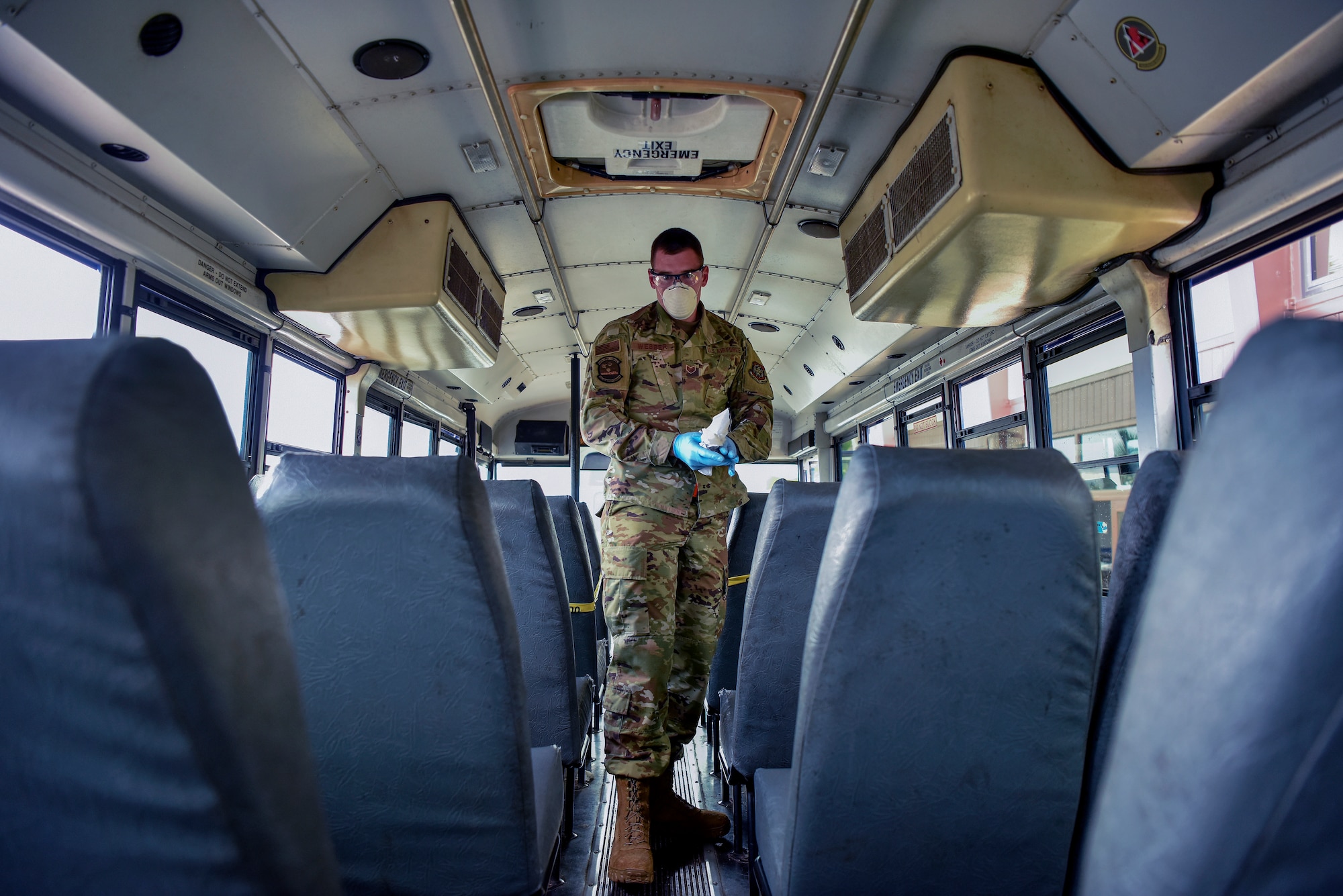U.S. Air Force Staff Sgt. Colton Webber,  735th Air Mobility Squadron passenger terminal shift supervisor, decontaminates a bus after transporting passengers to and from the aircraft at Joint Base Pearl Harbor-Hickam, Hawaii, March 25, 2020.

U.S. Indo-Pacific Command (INDOPACOM) directed implementation of Health Protection Condition (HPCON) Charlie March 24, 2020. (U.S. Air Force photo by Tech. Sgt. Anthony Nelson Jr. )