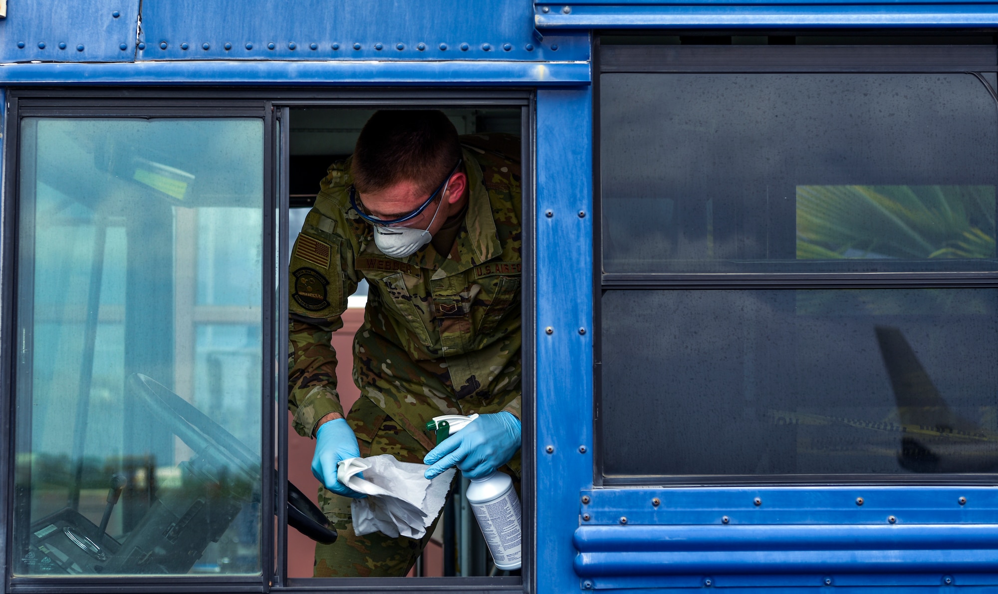 U.S. Air Force Staff Sgt. Colton Webber, 735th Air Mobility Squadron passenger terminal shift supervisor,  decontaminates the driver's seat after transporting passengers to and from the aircraft at Joint Base Pearl Harbor-Hickam, Hawaii, March 25, 2020.

U.S. Indo-Pacific Command (INDOPACOM) directed implementation of Health Protection Condition (HPCON) Charlie March 24, 2020.

(U.S. Air Force photo by Tech. Sgt. Anthony Nelson Jr. )