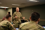 U.S. Air Force 1st Lt. Justin Rainier, a logistics readiness officer, assigned to the 178th Wing was called to State Active Duty and is currently serving on Joint Task Force-37 for Operation Steady Resolve, briefs commanders March 23, 2020, at the Defense Supply Center in Columbus, Ohio.