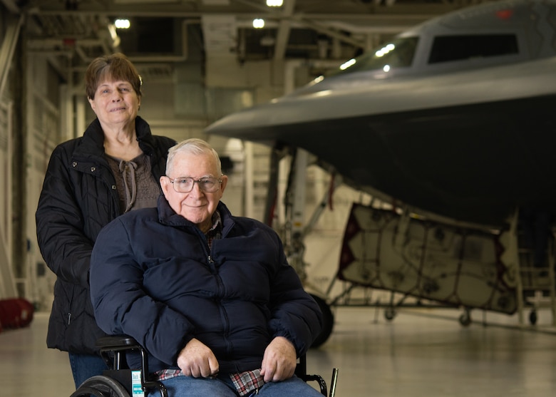 Ken Robbins and his wife, Jean, pose for a photo with the B-2 Spirit Stealth Bomber at Whiteman Air Force Base, Missouri, February 7, 2020. Robbins was invited to Whiteman AFB to fulfill his dream of seeing the B-2 in person. (U.S. Air Force photo by Senior Airmen Thomas Barley)