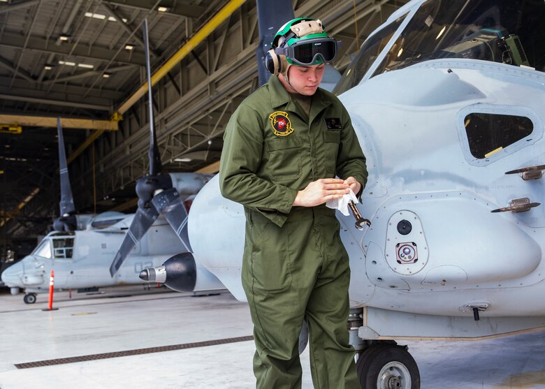 U.S. Marines with Marine Medium Tiltrotor Squadron 362, Marine Aircraft Group 16, 3rd Marine Aircraft Wing, enforce precautionary measures during the maintenance of MV-22 Osprey on Marine Corps Air Station Miramar, Calif., March 20, 2020. The purpose of these measures is to mitigate the spread of COVID-19 while continuing to perform mission essential tasks.(U.S. Marine Corps photo by Lance Cpl. Julian Elliott-Drouin)