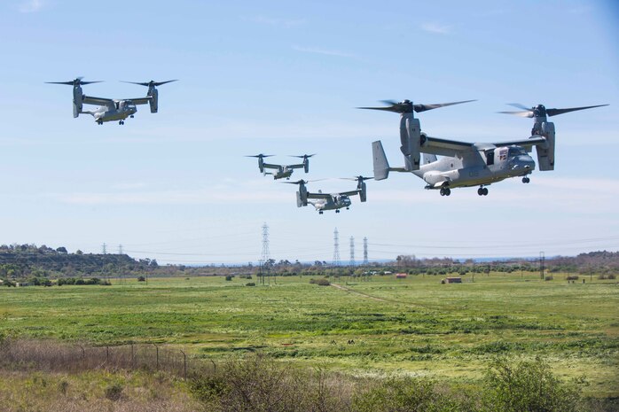 Four MV-22B Ospreys assigned to Marine Tiltrotor Squadron (VMM) 362, Marine Aircraft Group (MAG) 16, 3rd Marine Aircraft Wing (MAW), land near a simulated weapons engagement zone during an air assault in support of 1st Battalion, 3rd Marine Regiment, at Camp Pendleton, Calif., Feb. 26, 2020. Air assaults enable commanders to avoid enemy surfaces, exploit gaps, and maintain the flexibility and mobility needed to strike objectives in otherwise inaccessible areas during a Marine Air Ground Task Force mission. This culminating event signified that VMM-362 has reached full operational capability since its reactivation in 2018, ultimately increasing the lethality of 3rd MAW. (U.S Marine Corps photo by Lance Cpl. Julian Elliott-Drouin)