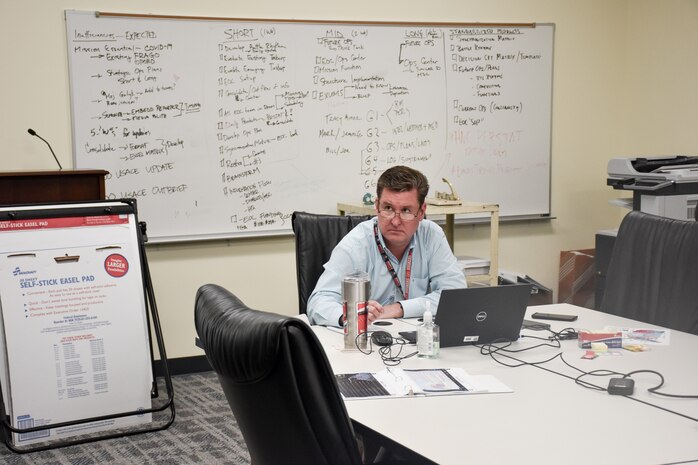 James Buhr, U.S. Army Engineering and Support Center, Huntsville project manager and Emergency Operations Center team member, listens during the U.S. Army Corps of Engineers daily commander’s telecon briefing March 25.