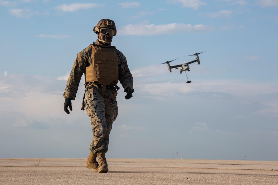 Marine walks off the flightline during external lift training at Morón Air Base, Spain, March 25.