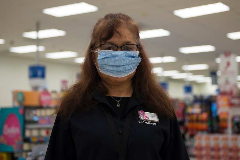 Merlinda Griffey, a sales associate at the Base Exchange main store, on Joint Base Charleston, S.C., poses for a photo in the Exchange on Joint Base Charleston, S.C., March 23, 2020.