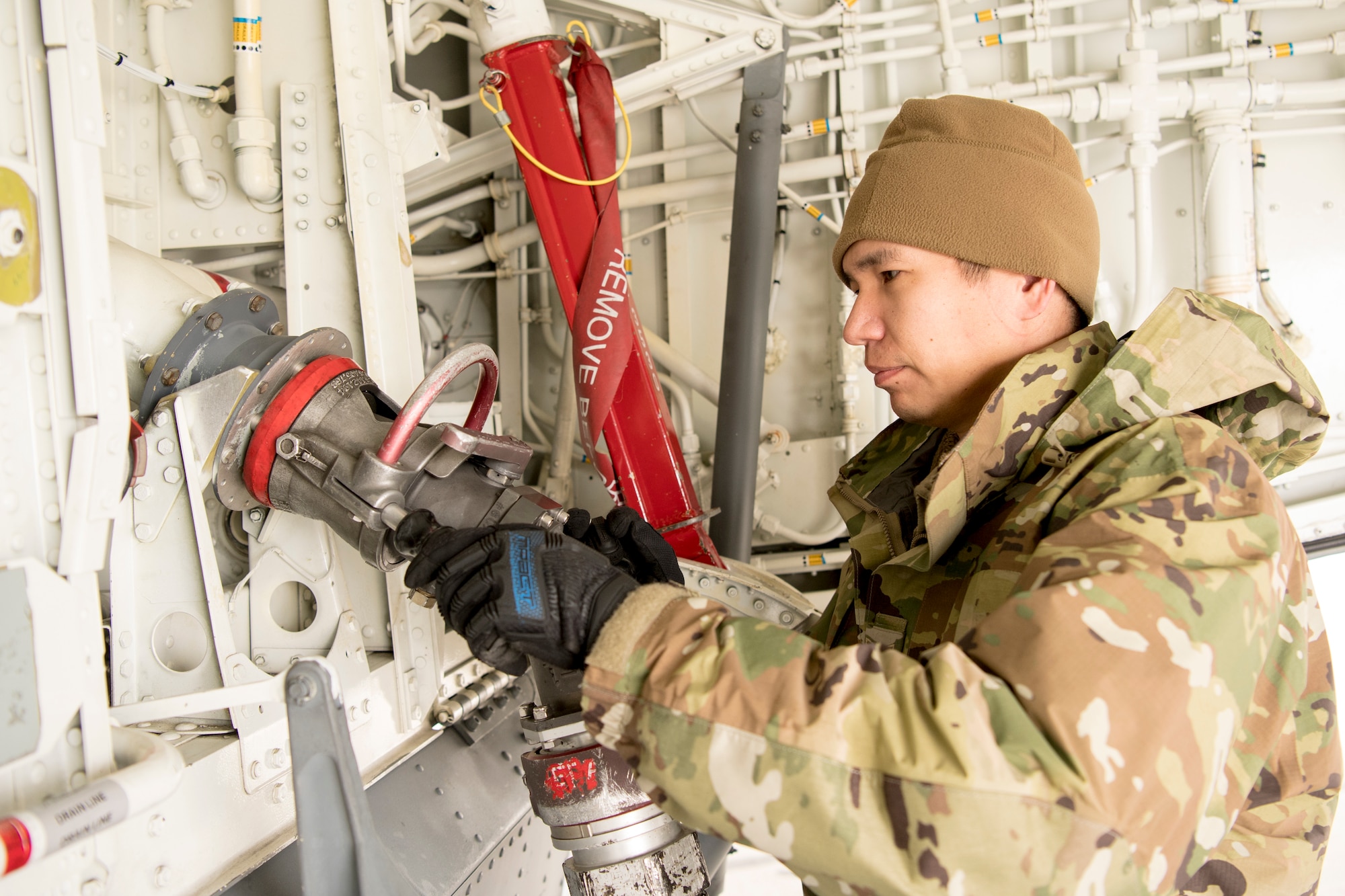 Tech. Sgt. David Taylor, 434th Aircraft Maintenance Squadron crew chief, fuels a KC-135R Stratotanker at Grissom Air Reserve Base, Indiana March 20, 2020. The tanker along with three other tankers are preparing to deploy to Southwest Asia in support of Air Force Central Command combat operations. (U.S. Air Force photo/Master Sgt. Ben Mota)
