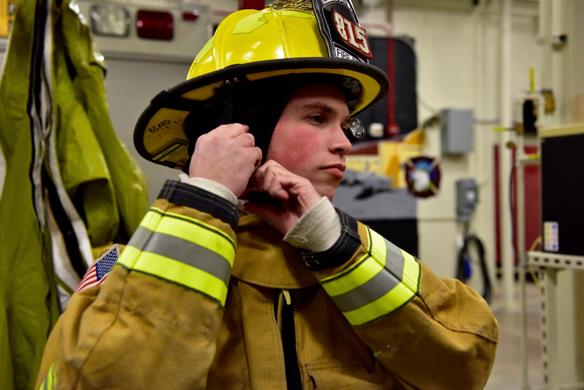Airman 1st Class Taylor Beard, a 354th Civil Engineer Squadron firefighter, dons fire protection equipment during a training exercise on Eielson Air Force Base, Alaska, March 26, 2020. Eielson firefighters wear approximately 40 lbs. of gear when responding to a fire, their training involves donning the gear within 60 seconds to cut down their response time when they are called to an emergency situation. (U.S. Air Force photo by Senior Airman Beaux Hebert)