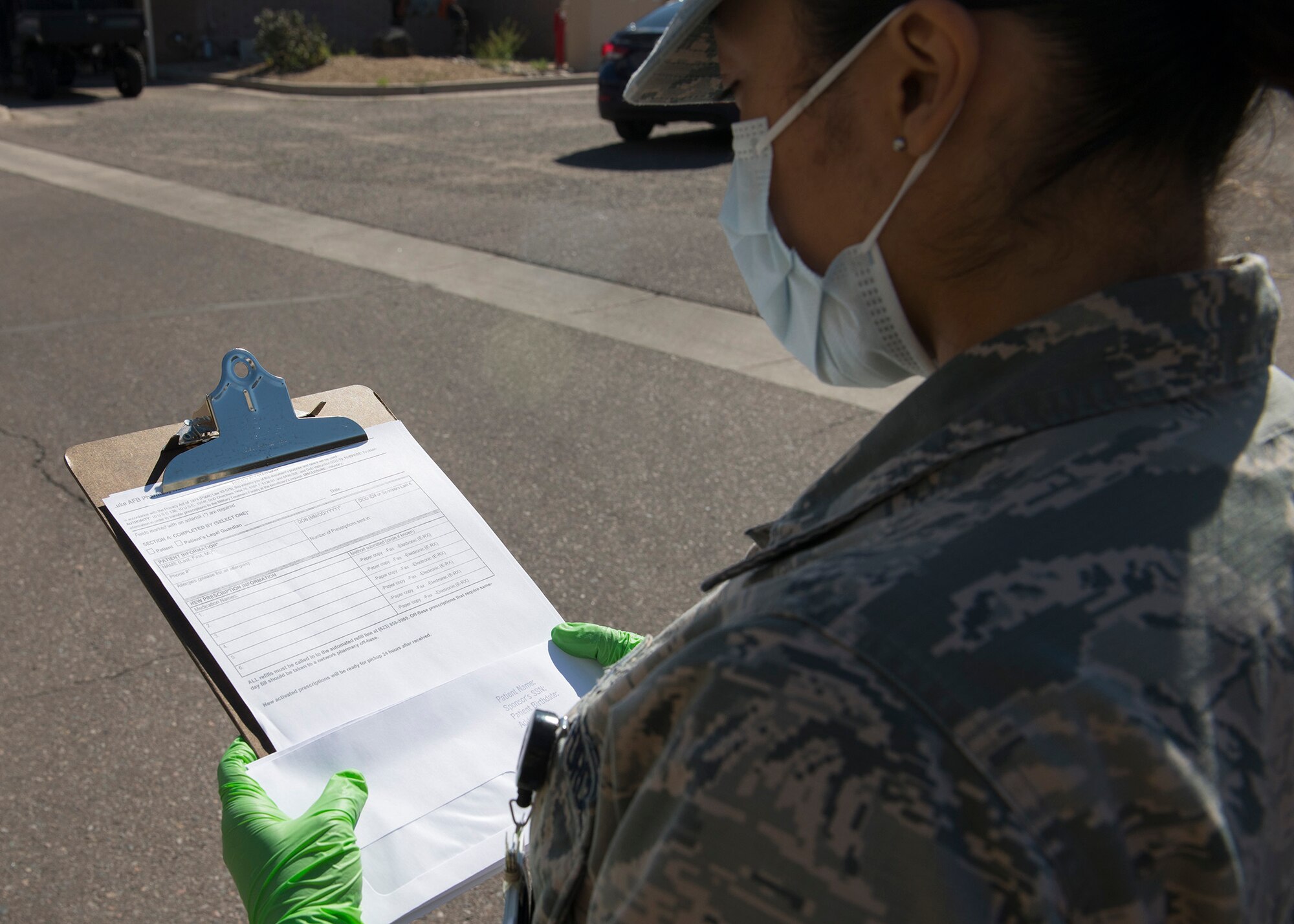 Airman 1st Class Erika Tolentino, 56th Medical Group pharmacy technician, prepares to fill a prescription activation form March 26, 2020, at Luke Air Force Base, Ariz.