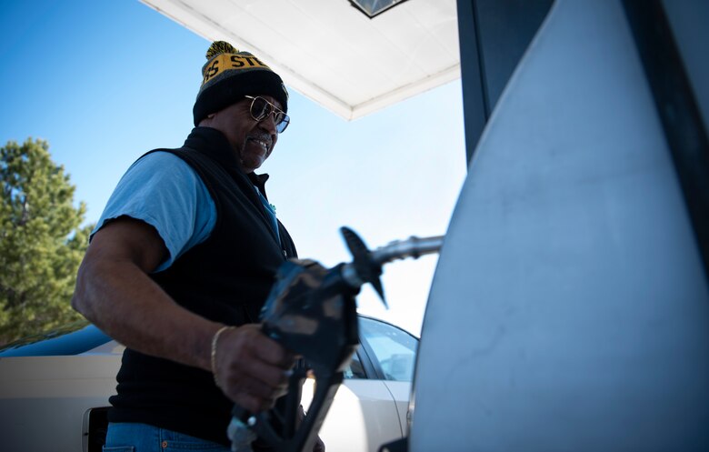 Aaron Taylor, 50th Civil Engineer Squadron project manager and inspector, attests the gas pump following the project inspection March 27, 2020, at Schriever Air Force Base, Colorado. Taylor was the first person to use the pumps since they closed December 2019. (U.S. Air Force photo by Airman Amanda Lovelace)