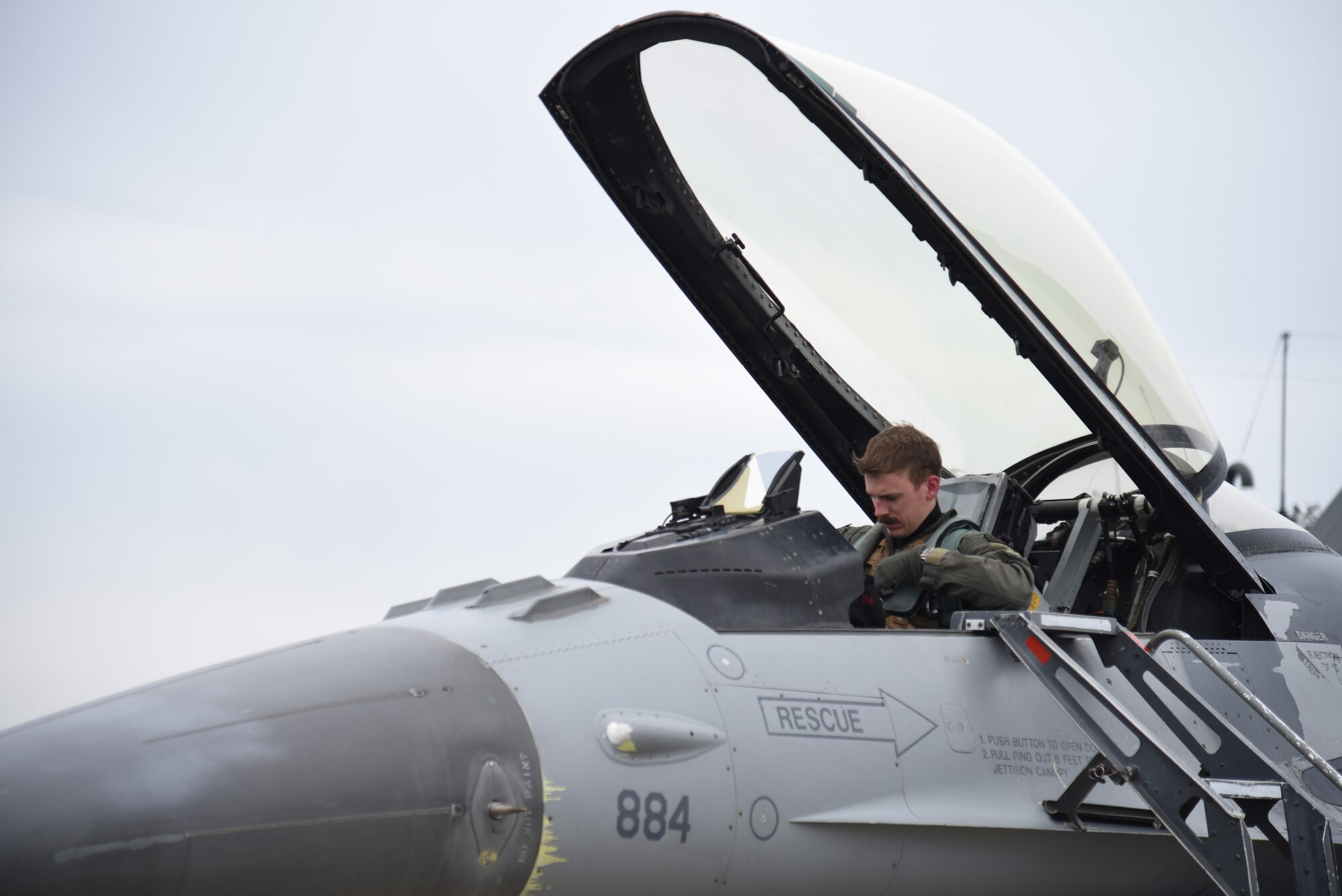 U.S. Air Force Captain Peter Magness, 13th Fighter Squadron electronic combat pilot, Misawa Air Base, Japan, prepares to exit his F-16 Fighting Falcon after Exercise PACIFIC WEASEL, Friday, March 27, 2020.  Each PAC WEASEL involves different assets and units. This exercise’s iteration included F-16s from the 13th and 14th Fighter Squadrons, command and control assets assigned to the 610th Air Control Flight, and surface-to-air missile simulators from the Japanese Ground Self Defense Force 101st Antiaircraft Artillery Unit from Camp Hachinohe.  (U.S. Air Force photo by Tech. Sgt. Chris Jacobs)