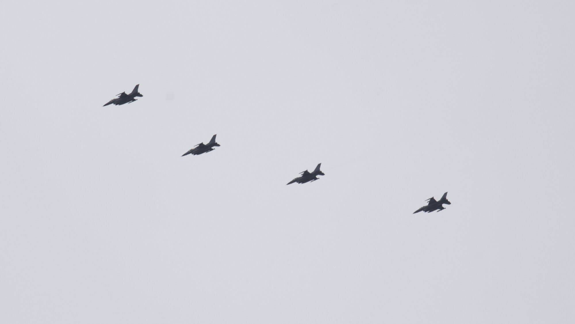 Four U.S. Air Force F-16 Fighting Falcons, assigned to Misawa Air Base, Japan, fly in formation after executing Exercise PACIFIC WEASEL, Friday, March 27, 2020. Each PAC WEASEL involves different assets and units. This exercise’s iteration included F-16s from the 13th and 14th Fighter Squadrons, command and control assets assigned to the 610th Air Control Flight, and surface-to-air missile simulators from the Japanese Ground Self Defense Force 101st Antiaircraft Artillery Unit from Camp Hachinohe.  (U.S. Air Force photo by Tech. Sgt. Chris Jacobs)