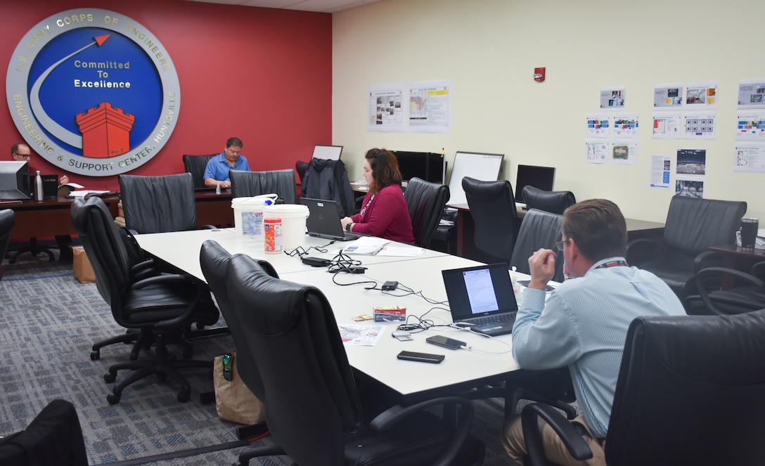 U.S. Army Engineering and Support Center, Huntsville Emergency Operations Center staff observe social distancing during operations at the Huntsville Center headquarters March 25.