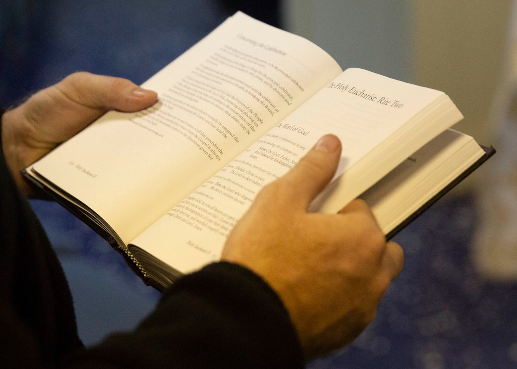 A Sailor reads a bible during Protestant church service aboard USS Iwo Jima (LHD 7), Oct. 14. Church services allow Marines and Sailors to practice their faith while underway. (U.S. Marine Corps photo by Lance Cpl. Gumchol Cho)
