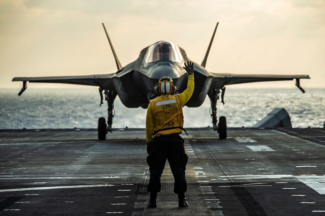 An F-35B Lightning II fighter aircraft prepares to take off from the flight deck of  the USS America March, 25.