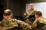 U.S. Air Force Lt. Col. Gary Katz, a flight surgeon assigned to the 178th Wing serving on Joint Task Force-37, briefs commanders March 23, 2020, at the Defense Supply Center in Columbus, Ohio. Katz is one of more than 400 members of the Ohio National Guard supporting food distribution at 12 locations across Ohio serving more than 11 million Ohioans in all 88 counties.