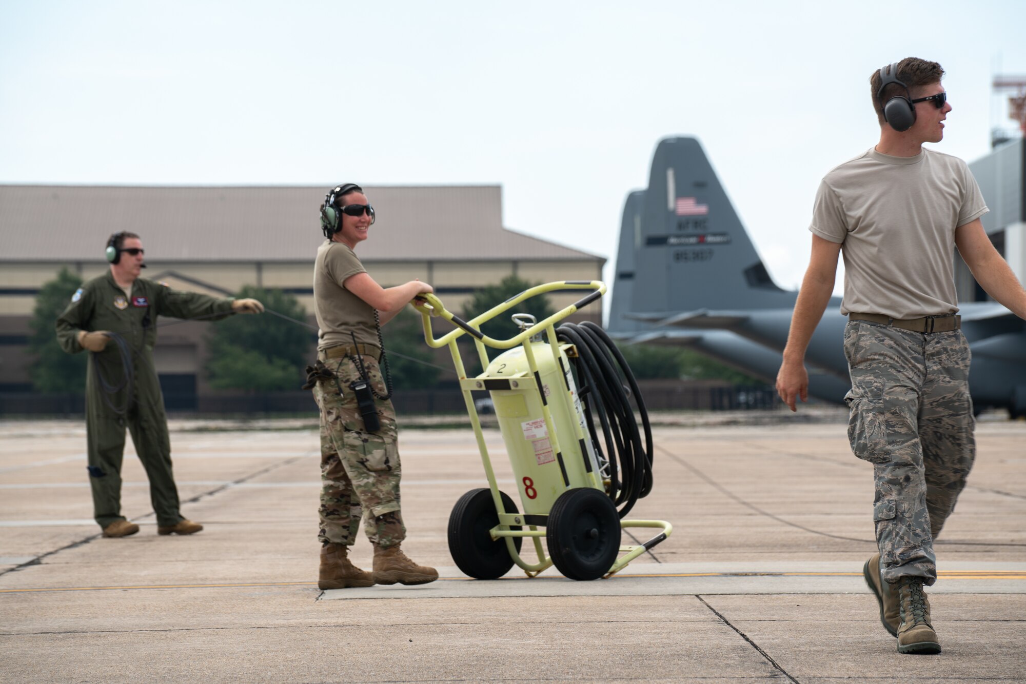 Tech. Sgt. Lacey Matthews prepares a C-130J Super Hercules aircraft for takeoff from Keesler Air Force Base, Mississippi, July 30, 2019. She serves in the Air Force Reserve as a crew chief with the 403rd Aircraft Maintenance Squadron. Her job also includes performing aircraft maintenance, inspections, and refueling. (U.S. Air Force photo by Staff Sgt. Shelton Sherrill)