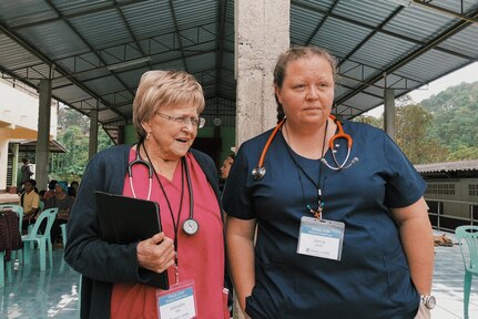 IMAGE: CHIANG MAI region, Thailand (Nov. 2018) – Naval Surface Warfare Center Dahlgren Division (NSWCDD) Engineering Technician Janna Roland, right, and Registered Nurse Jeanette Wachtler of Alberta, Canada joined a team of 27 medical and dental professionals who served more than 1,600 patients in five days during a mission trip to Thailand through Hand of Hope, Joyce Meyer Ministries World Missions, Oct. 25-Nov. 4, 2018. Roland received the NSWCDD Distinguished Community Service Award in 2019 for “outstanding contributions to the community” for participating in the trip as well as serving more than 16 years as an EMT for the Chancellor Volunteer Fire and Rescue Department, which serves parts of Spotsylvania County, Va. “Roland selflessly shares her extensive expertise to help those in the local community and abroad,” cites the award. (U.S. Navy photo/Released)