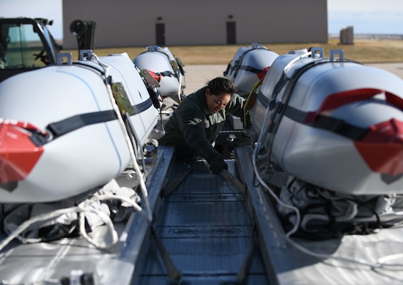 Airman secures Joint Air to Surface Standoff Missiles on flatbed truck at munitions storage area on Ellsworth Air Force Base, South Dakota, October 2019, as part of U.S. Strategic Command’s exercise Global Thunder 20 (U.S. Air Force/Christina Bennett)