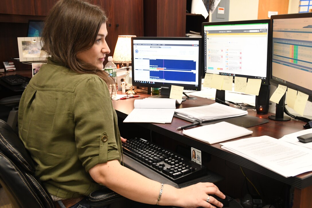 Karen Watts, 104th Fighter Wing Emergency Management, monitors and coordinates with the Emergency Operation Center on critical information requests in response to COVID-19, March 30, 2020. Watts coordinates with emergency management interagency partners in her community throughout Western Massachusetts in response to emergency management crisis situations. (U.S. Air National Guard Photo by Senior Master Sgt. Julie Avey)