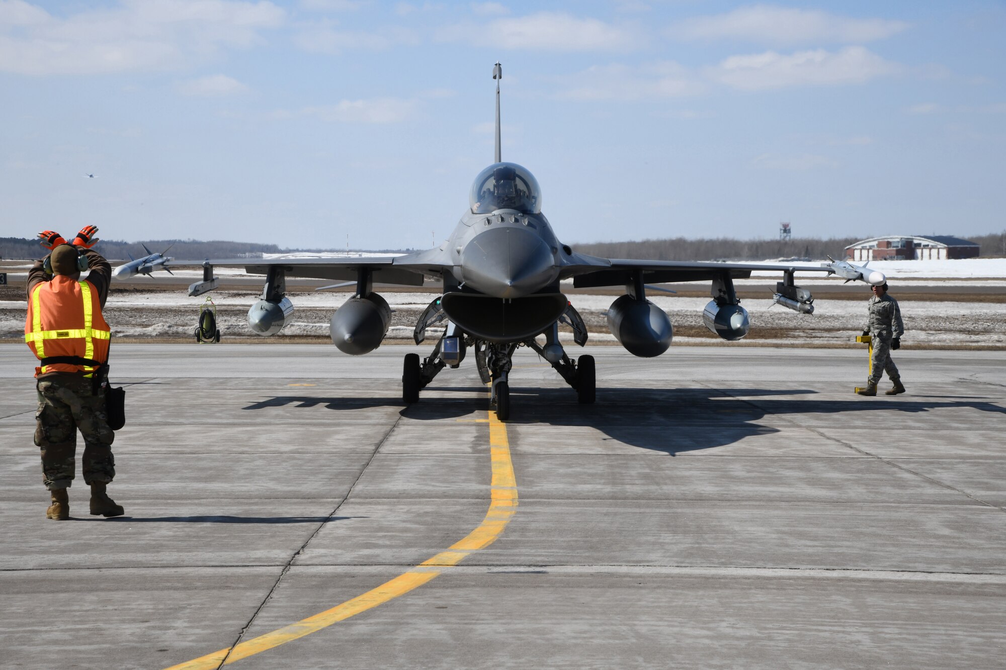 Aircraft maintenance personnel from the 148th Fighter Wing recover a Block 50CM F-16 Fighting Falcon upon its' return from an Operation NOBLE EAGLE deployment.