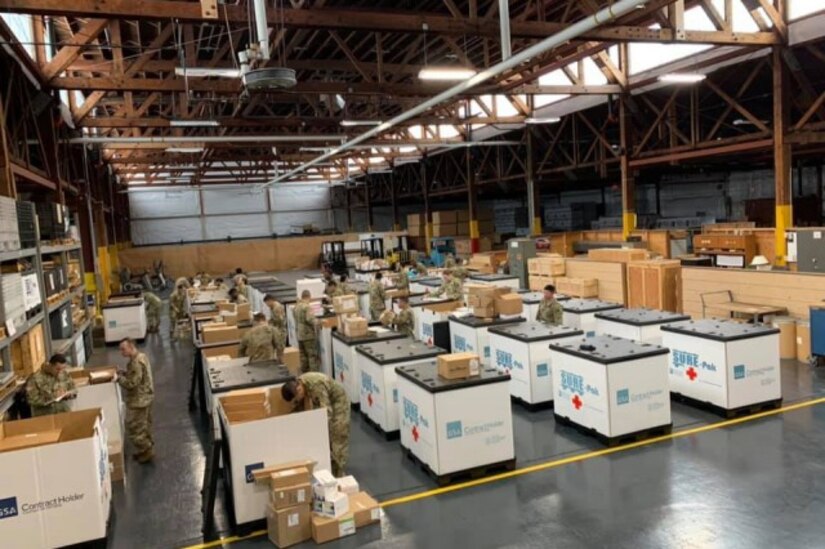 Soldiers from the 551st Medical Company (Logistics) and the 627th Hospital Center unload tri-walls of medical supplies as they arrive at Joint Base Lewis McChord, Washington, in support of COVID-19 relief efforts. (Photo Credit: U.S. Army)