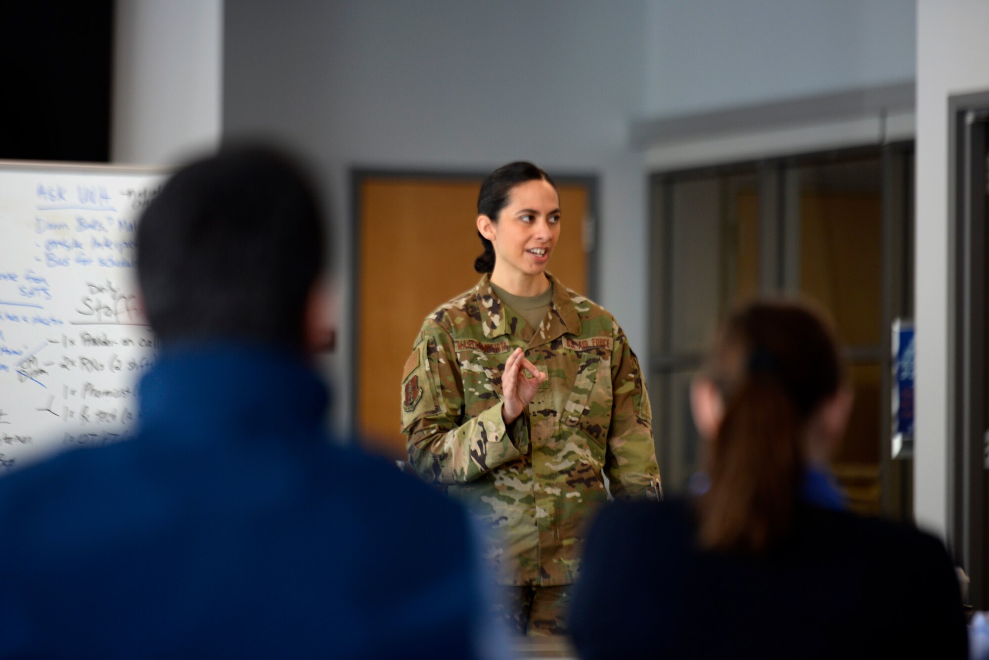 Maj. Michelle Mastrobattista, administration officer for the 157th Medical Group, New Hampshire Air National Guard, discusses with regional hospital representatives the operations scope of the additional care site at the Hamel Recreation Center, University of New Hampshire on March 26. The facility in Durham will augment area hospitals treating COVID-19 cases, if necessary. It is one of nine "surge" locations the NH Guard, in coordination with local and state healthcare agencies, plans to set up and manage across the state. (U.S. Air National Guard photo by Tech. Sgt. Aaron Vezeau)