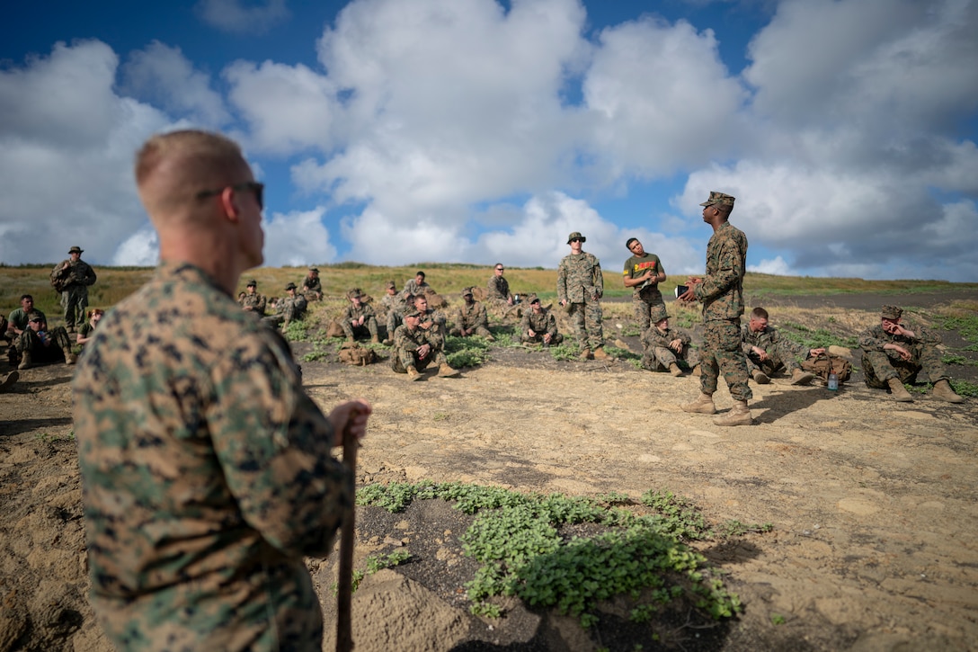 Marine with Headquarters Battalion, 3rd Marine Division, talks about World War II beach landing on Iwo Jima during professional military education brief,
Iwo Jima, Japan, November 26, 2019 (U.S Marine Corps/Esgar Rojas)