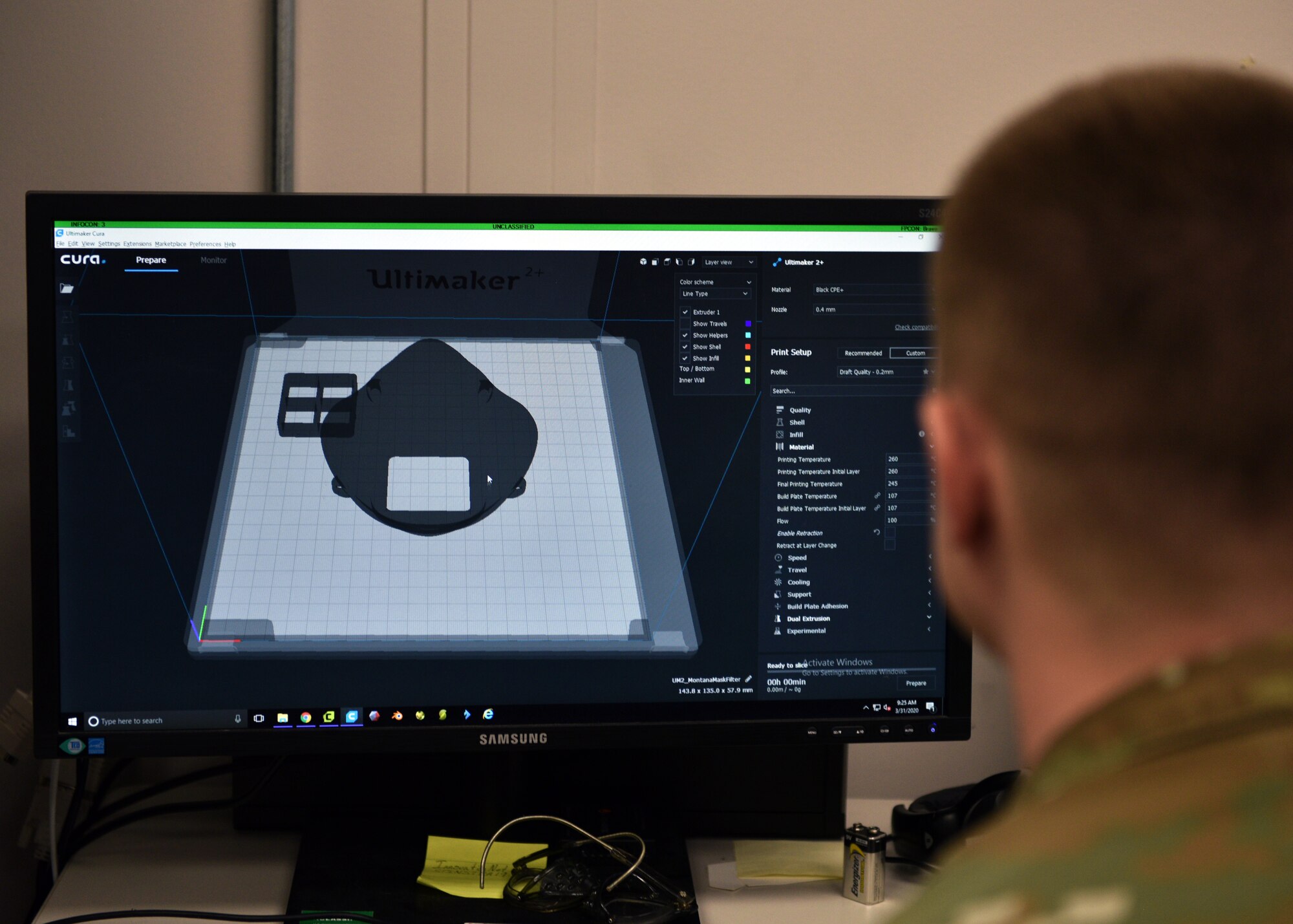 U.S. Air Force Tech. Sgt. Tracy Gibbs, 312th Training Squadron Special Instruments Training course graduate, prepares a 3D printed N95 face mask to be printed through modeling software at the Louis F Garland Department of Defense Fire Academy on Goodfellow Air Force Base, Texas, March 31, 2020. In an effort to help protect those caring for sick individuals around the world, a neurosurgeon in Billings, Montana, made a model available online for a free 3D printable, high-efficiency filtration mask with a design that allows reuse of the mask. (U.S. Air Force photo by Airman 1st Class Robyn Hunsinger)
