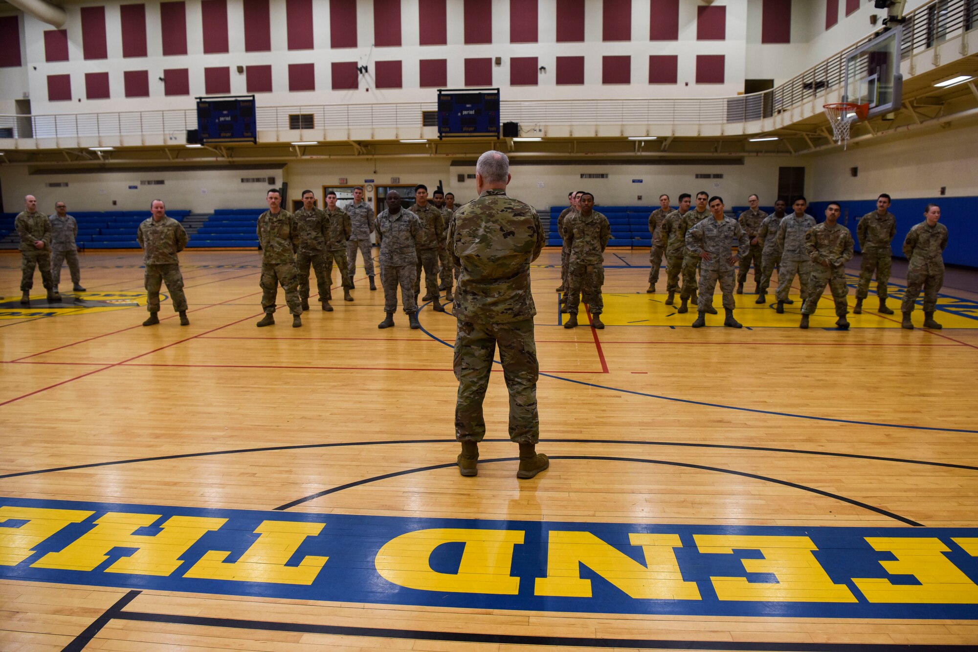 U.S. Air Force Chief Master Sgt. Philip Hudson, 7th Air Force command chief, speaks with 8 Force Support Squadron personnel during a base visit at Kunsan Air Base, Republic of Korea, March 26, 2020. Hudson learned about how the 8th Fighter Wing is ensuring the safety of Airmen on base and how they modified unit operations to accomplish their mission and remain safe during the COVID-19 response. (U.S. Air Force photo by Senior Airman Jessica Blair)