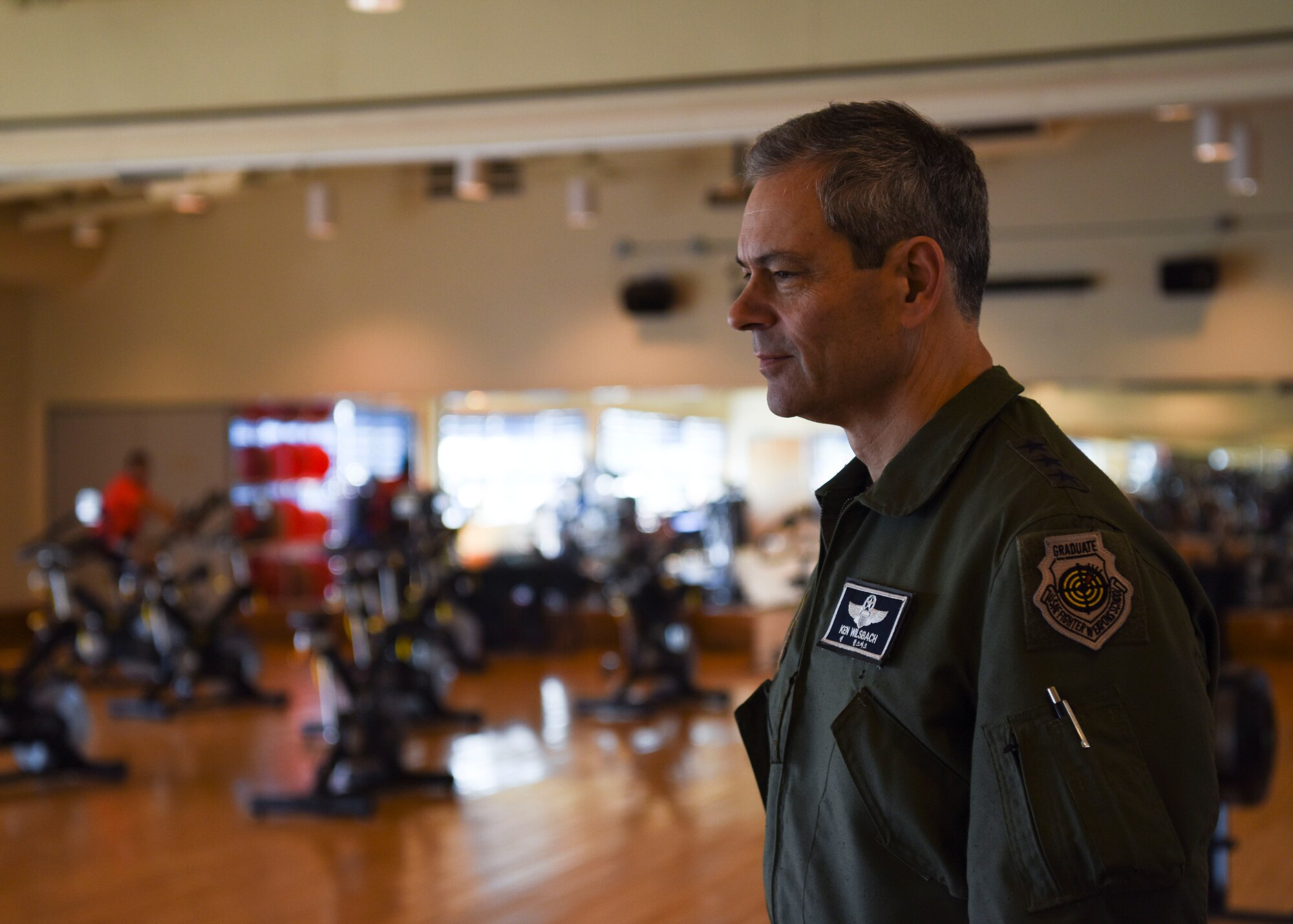 U.S. Air Force Lt. Gen. Kenneth Wilsbach, 7th Air Force commander, learns how the fitness center remains operational during a base visit at Kunsan Air Base, Republic of Korea, March 27, 2020. During his visit, Wilsbach had the opportunity to speak with Airmen from different entities around the base to see what precautionary measures they are taking to keep the base safe and healthy. (U.S. Air Force photo by Senior Airman Jessica Blair)