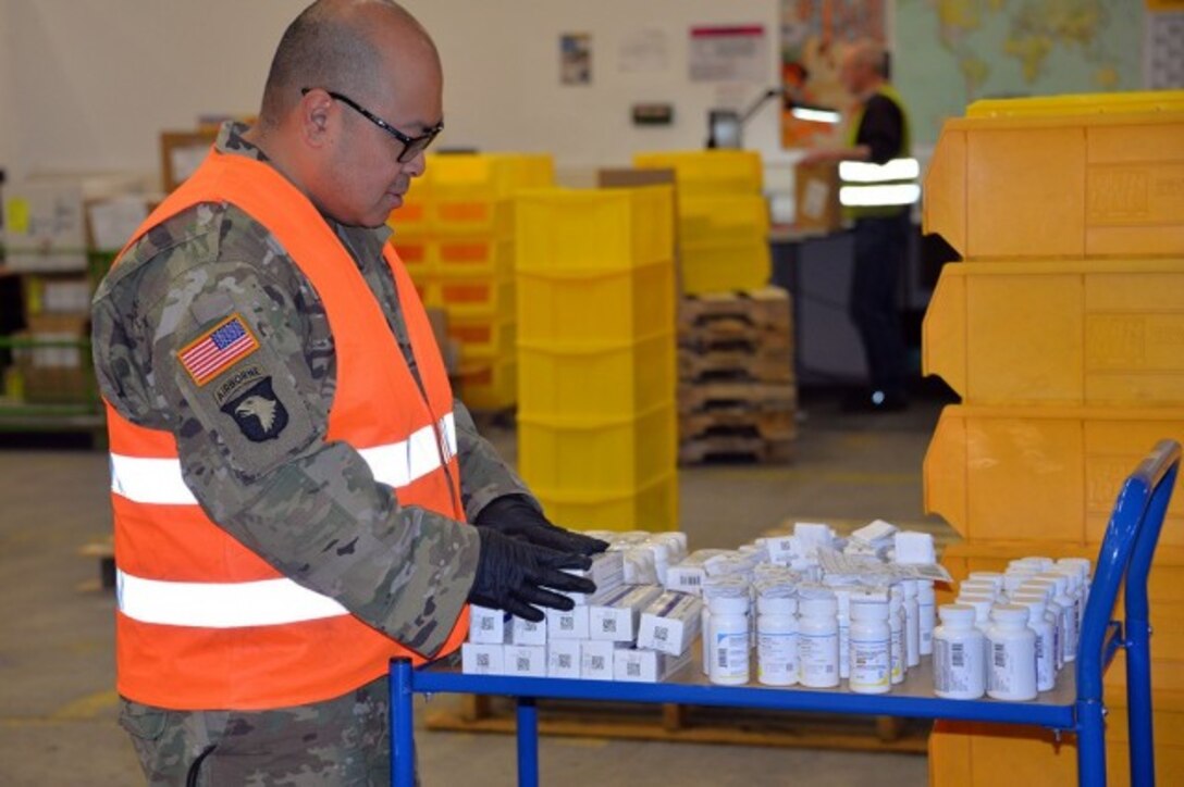 A Soldier from the 7th Mission Support Command works in the warehouse at the U.S. Army Medical Materiel Center-Europe in Germany in support of COVID-19 response efforts.