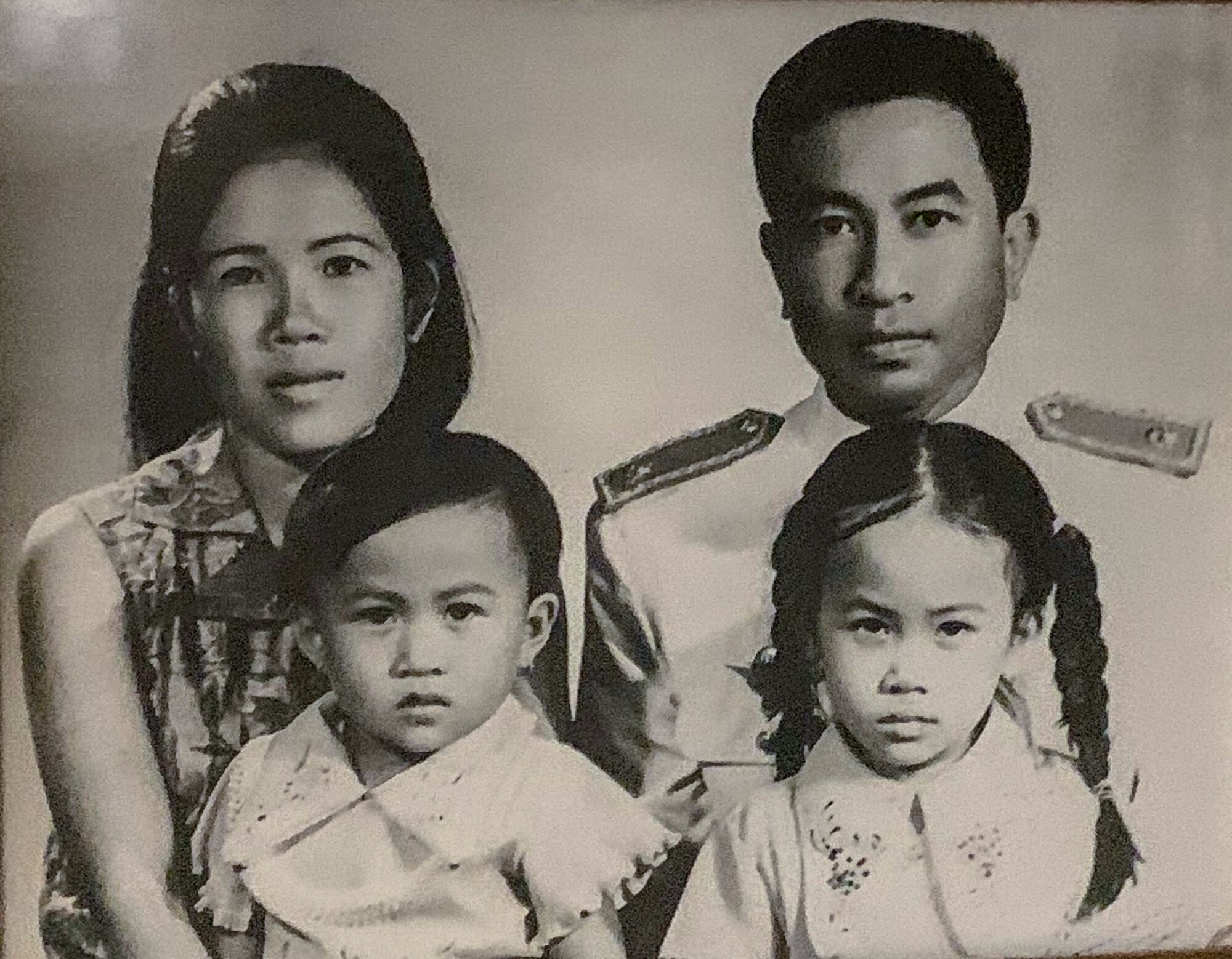 Senior Airman Elizabeth Soisouvanh's grandparents pose with their daughters for a family portrait in 1972.