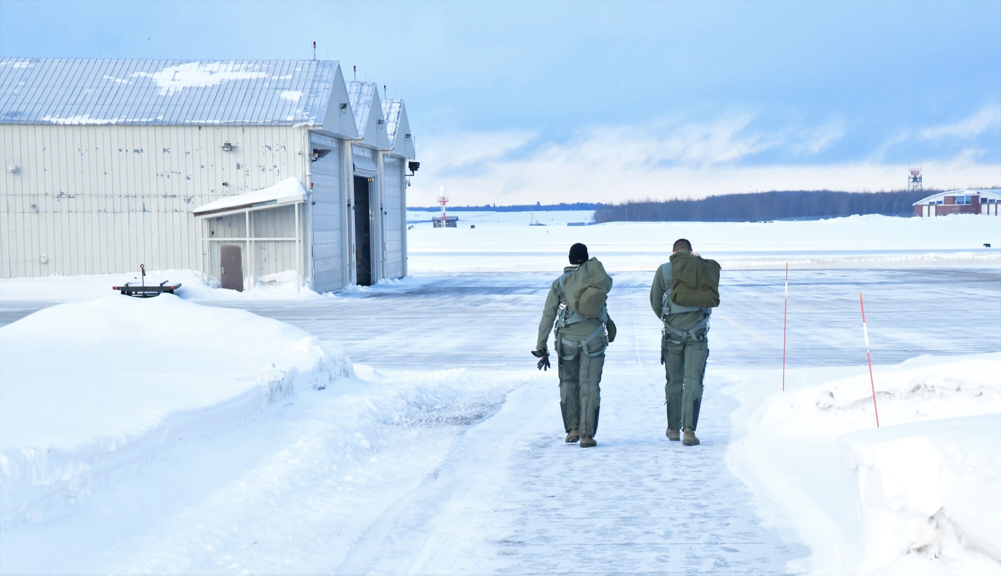 148th Fighter Wing pilots walk to their jets before taking off to support a NORAD tasked Operation NOBLE EAGLE deployment.