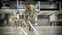 Soldier lays down tape