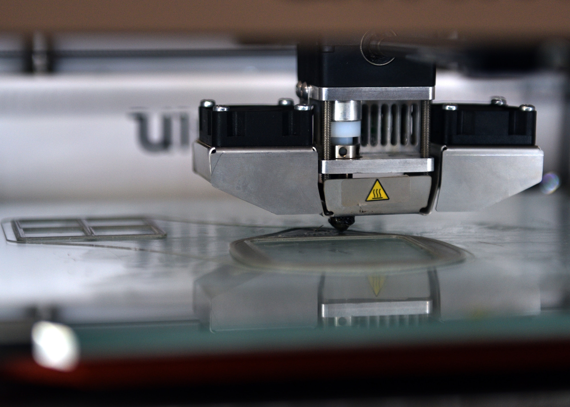 A 3D printer creates a prototype N95 face mask at the Louis F Garland Department of Defense Fire Academy on Goodfellow Air Force Base, Texas, March 31, 2020. This is the medical regulation/grade personal protective equipment that is used to protect the wearer from airborne particles and from liquid contaminating the face. (U.S. Air Force photo by Airman 1st Class Robyn Hunsinger)