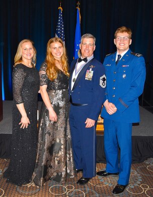 United States Air Force Academy Cadet 3rd Class Jack Johnson was able to attend his father’s Chief Induction Ceremony with his mother Sirese, and sister Hattie, in February at Tinker Air Force Base, by flying on an E-3 Sentry Airborne Warning and Control System as part of the sponsor-base program. Chief Master Sergeant Dustin Johnson joined the Air Force in July 1996 and served as an Airborne Radar Technician; he promoted to the rank of chief master sergeant on April 1 and currently serves as the squadron superintendent for the 552nd Operations Support Squadron (U.S. Air Force photo by 2nd. Lt Ashlyn K. Paulson).