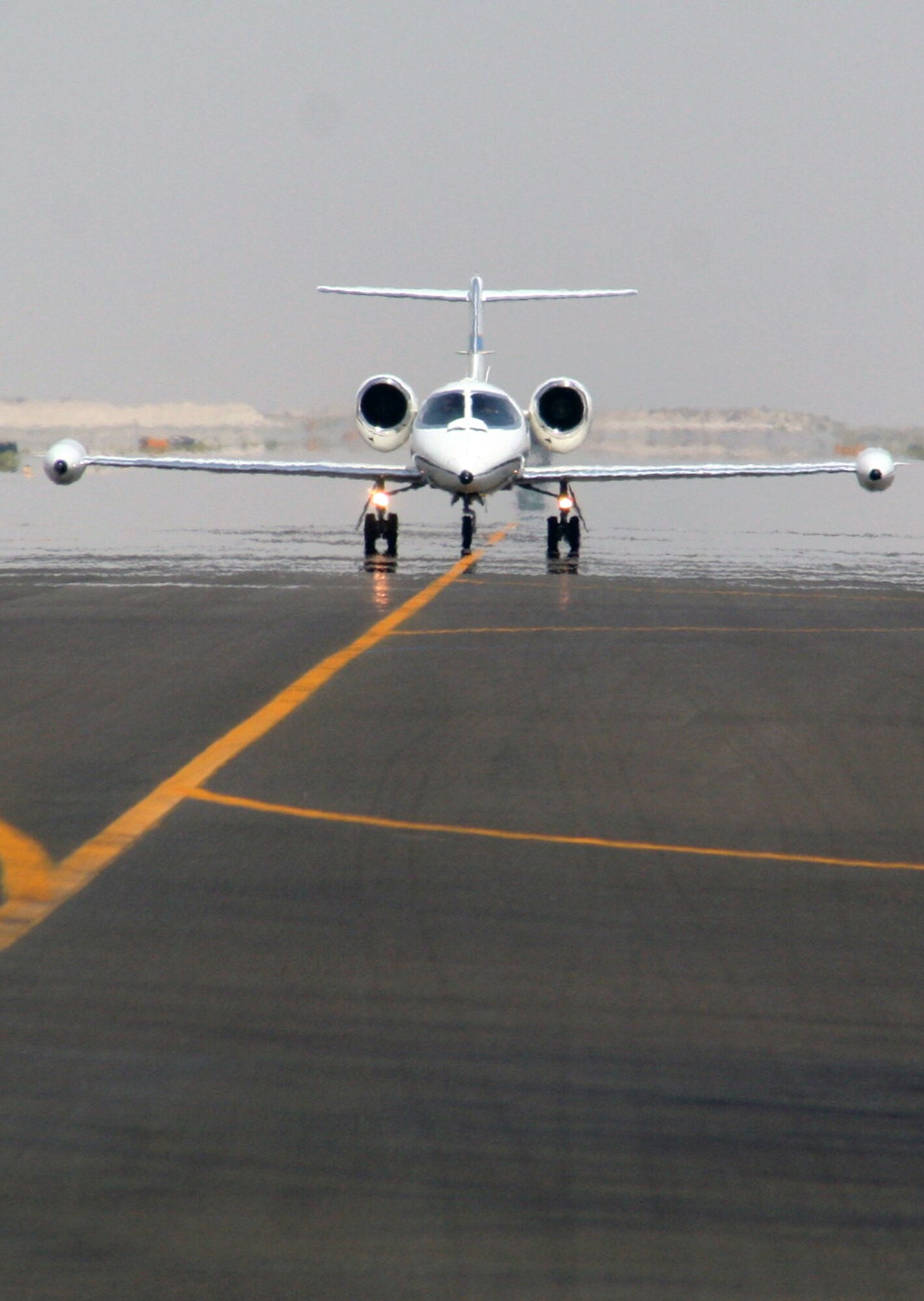 A C-21 passenger jet taxis on the runway to the flightline of the 380th Air Expeditionary Wing at a non-disclosed location in Southwest Asia on May 19. The C-21, according to its Air Force fact sheet, is a twin turbofan engine aircraft used for cargo and passenger airlift. The aircraft is the military version of the Lear Jet 35A business jet. In addition to providing cargo and passenger airlift, the aircraft is capable of transporting one litter or five ambulatory patients during aeromedical evacuations. The C-21 can carry eight passengers and 42 cubic feet (1.26 cubic meters) of cargo.