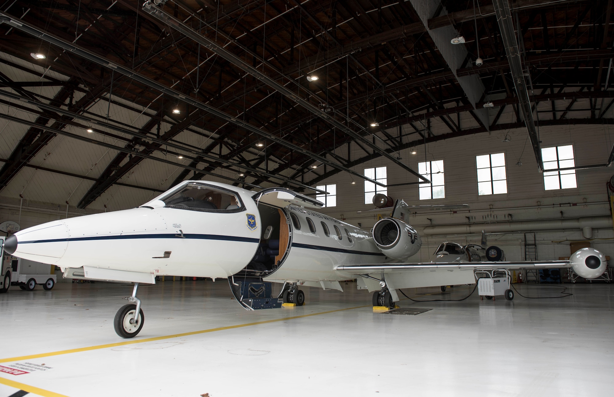 The 458th Airlift Squadron houses a C-21 aircraft in Hangar 3, May 18, 2018, at Scott Air Force Base, Illinois. The C-21 is primarily used for cargo and passenger airlift, and it can carry up to eight passengers and 42 cubic feet of cargo. (U.S. Air Force photo by Airman 1st Class Tara Stetler).