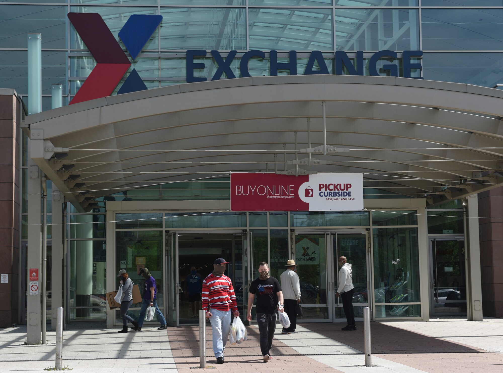 Customers exit the Base Exchange at Ramstein Air Base, Germany, April 21, 2020.
